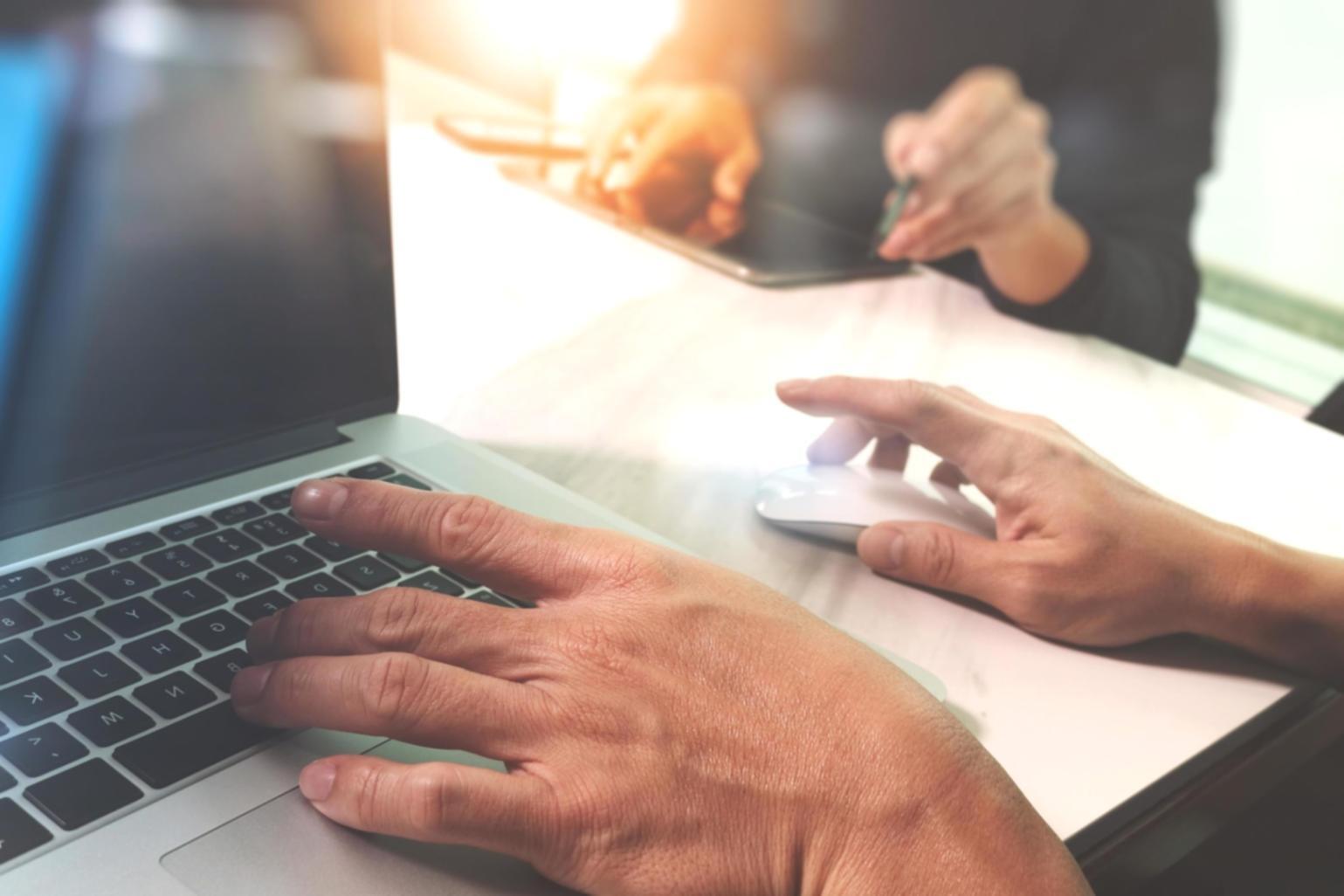 Modern workspace with development team collaborating on mobile solutions