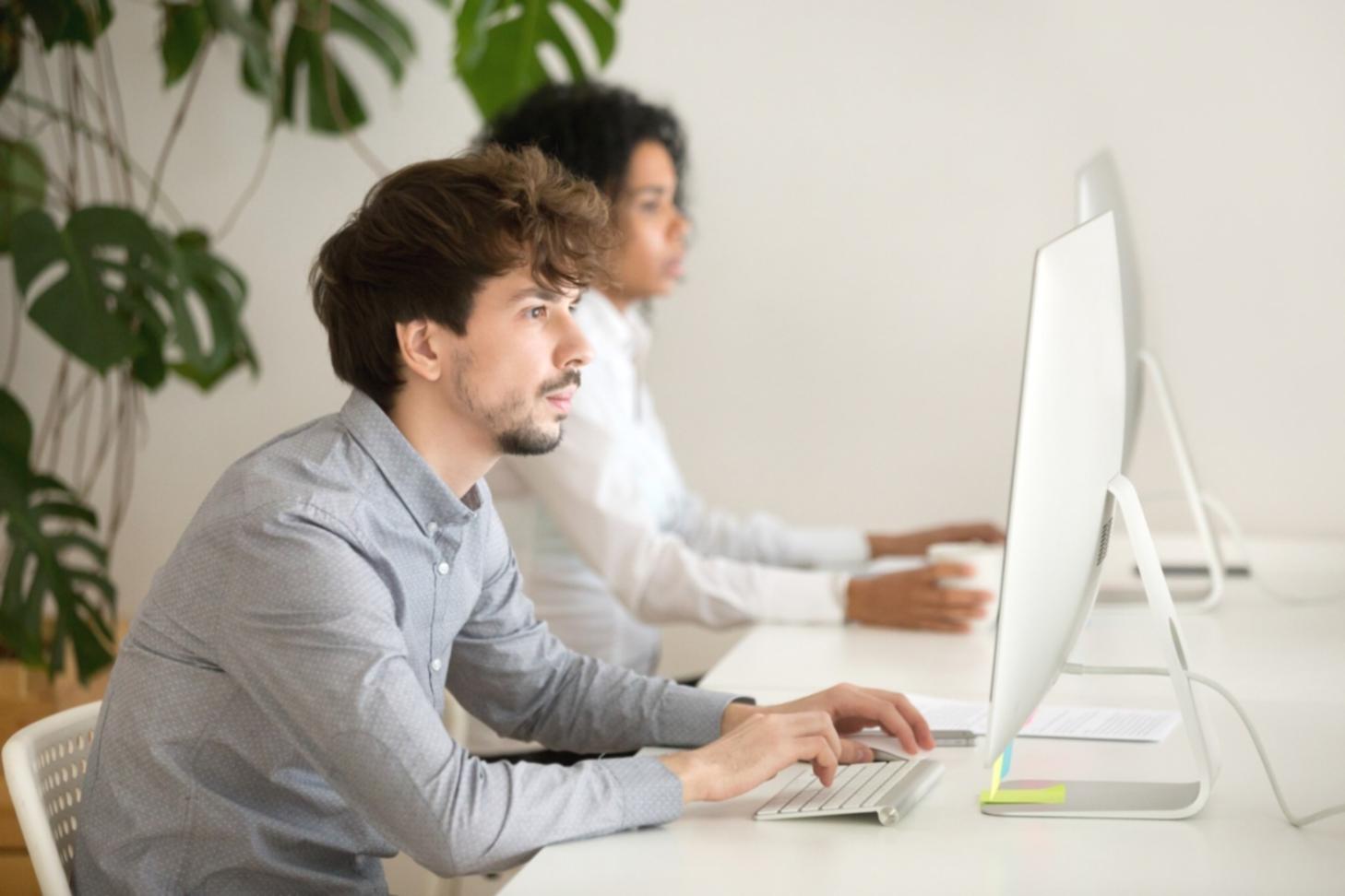 Team collaboration session with partners reviewing mobile application prototypes